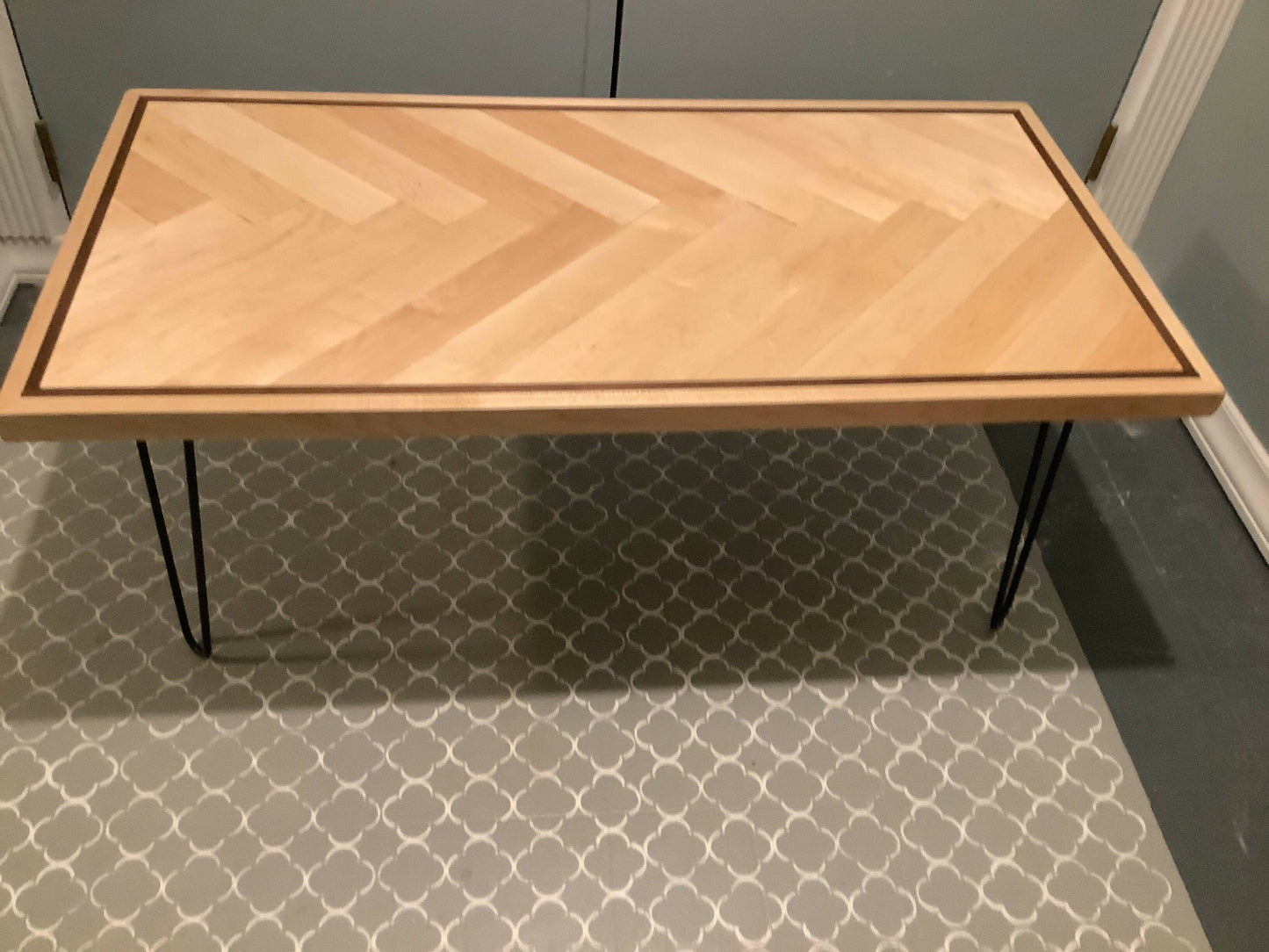 Maple coffee table with walnut inlay